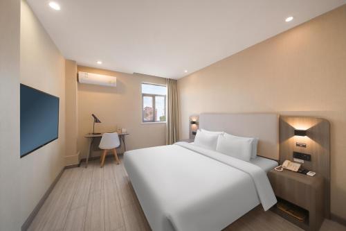 Ένα ή περισσότερα κρεβάτια σε δωμάτιο στο Elan hotel Hotel - Nanjing Zhongshan Mausoleum Scenic Area South Technology