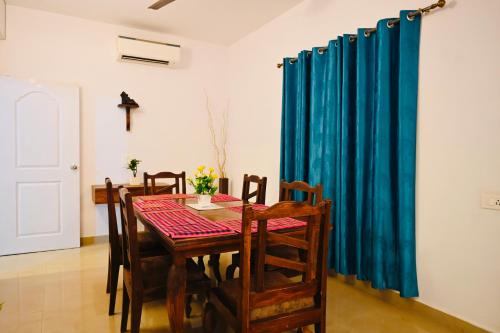 a dining room with a table and chairs at Siolim 6bhk Private Villa with Private Pool close to Anjuna Vagator in Siolim