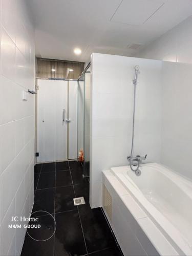 a bathroom with a bath tub and a shower at Encorp Strand Bathtub Elegant Design 3pax By MWM in Petaling Jaya