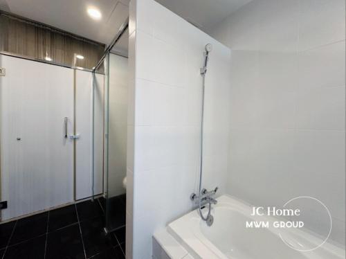 a bathroom with a shower and a bath tub at Encorp Strand Bathtub Elegant Design 3pax By MWM in Petaling Jaya