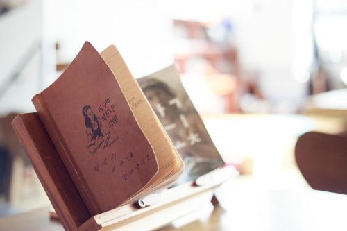 a book sitting on top of a table at Andong Poong-gyung HOSTEL n LIBRARY in Andong