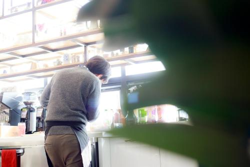 a person standing in front of a refrigerator at Andong Poong-gyung HOSTEL n LIBRARY in Andong