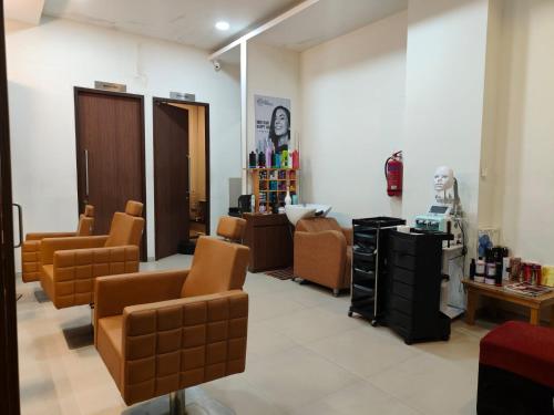 a salon with chairs and a waiting room at Astonishing 3BHK at 6-Floor for Family only in Bengaluru