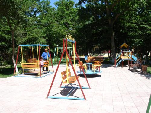 a group of playground equipment in a park at Hotel Bulaq in Turist