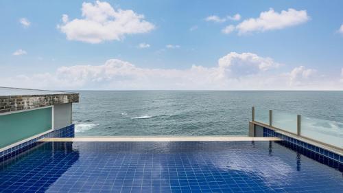 a swimming pool overlooking the ocean on a cruise ship at Elafonisi Poolvilla & Hotel in Gyeongju