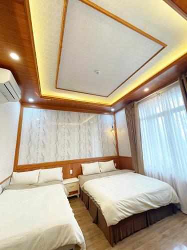 a bedroom with two beds in a boat at BinBin Homestay Đồng Hới Quảng Bình in Dong Hoi