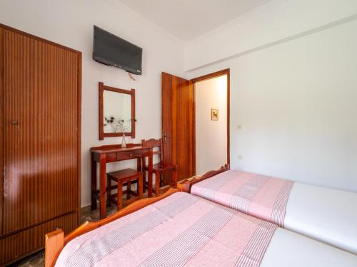 Ένα ή περισσότερα κρεβάτια σε δωμάτιο στο XENOFONTAS APARTMENTs