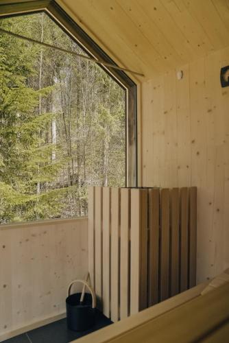 a room with a large window in a cabin at Salzbergalm in Berchtesgaden