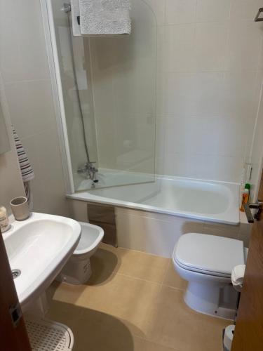 a bathroom with a sink and a toilet and a tub at Casa Helen Las Terrazas de la Torre - Blue Sky Property in Murcia