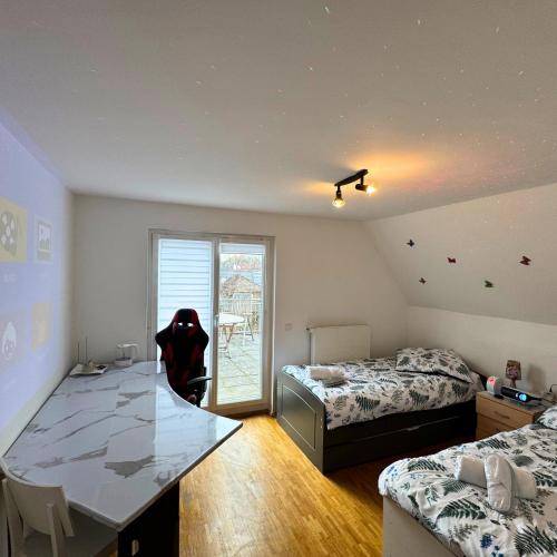a bedroom with two beds and a table with a dog in it at München Haus-Centrum-Messe-Oktoberfest -7-24 CHECKIN in Munich