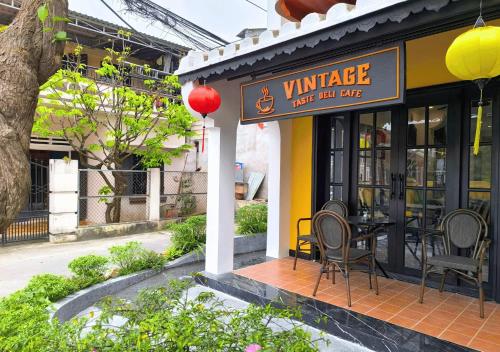 a restaurant with a table and chairs outside of it at Yzistel Hoi An in Hoi An
