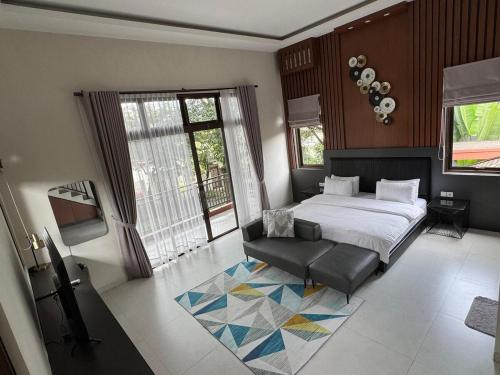 Ένα ή περισσότερα κρεβάτια σε δωμάτιο στο Villa Verde by Terra Homes