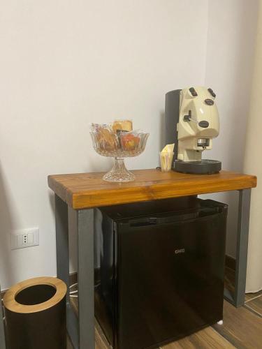 a table with a bowl of food on top at Umberto primo rooms in Castelbuono