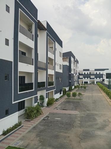 an empty parking lot in an apartment building at Happy Homes in Abuja