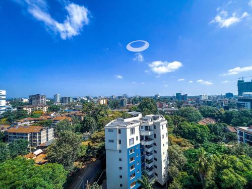 a frisbee flying in the sky over a city at Stone Age Nairobi --- Rooftop Pool & Lounge, Gym, Games room, Office Space in Nairobi