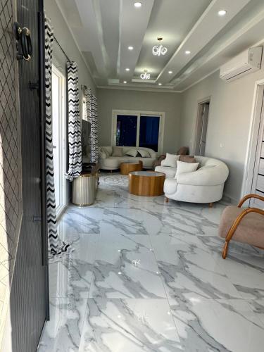 a living room with a marble floor at Beautiful secluded apartment with pool in Sharm El Sheikh