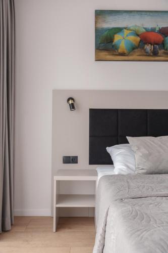 Katil atau katil-katil dalam bilik di Apartment Oskar - Basen & SPA - Dziwnów