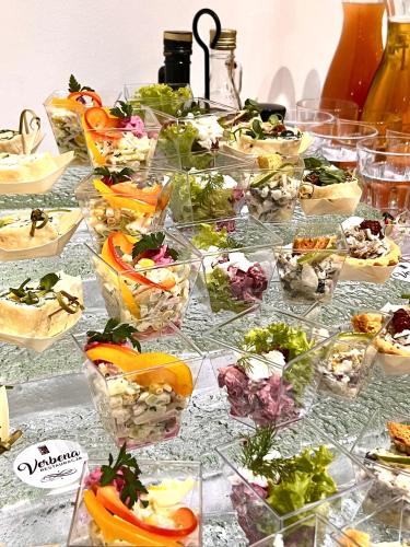 a buffet with many different types of food in glass dishes at Papuga Park Hotel Wellness Marrakesz & SPA in Bielsko-Biala