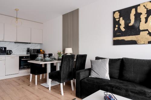 Dapur atau dapur kecil di Apartment Oskar - Basen & SPA - Dziwnów