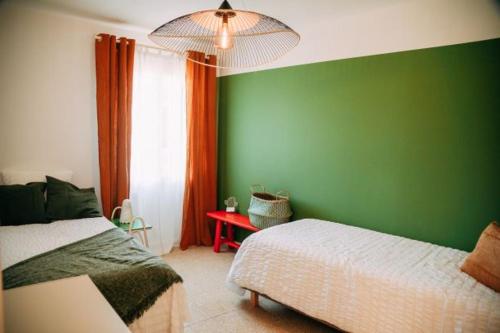 Ένα ή περισσότερα κρεβάτια σε δωμάτιο στο Maison Verveines