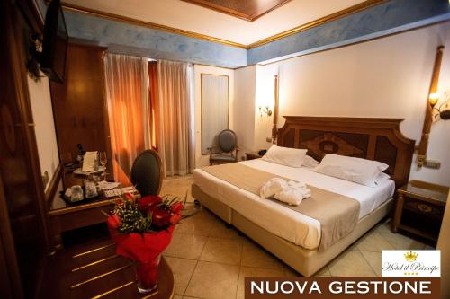 a hotel room with a large bed in a room at Hotel Il Principe in Milazzo