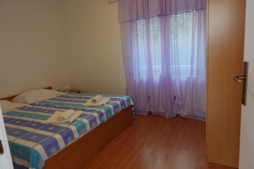 Postel nebo postele na pokoji v ubytování Apartman Ana