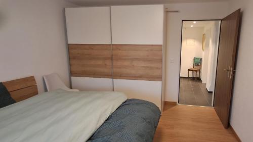 a bedroom with a bed and a sliding glass door at Helvetia 2005 Sr 2-ZW 2 Stock in Lenzerheide