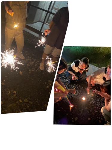 a group of people playing with sparklers at JaM in Noboribetsu