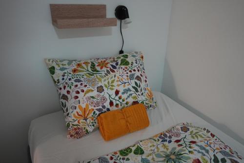 A bed or beds in a room at Center Hostel and Guest House
