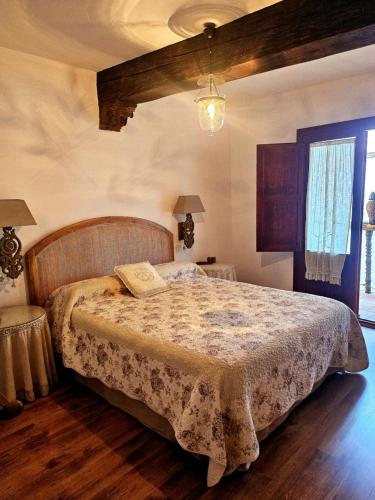 a bedroom with a large bed in a room at La Casa de Sofía in Navaconcejo