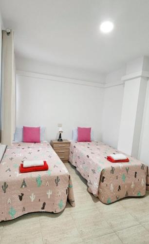 En eller flere senge i et værelse på Casa Ángel