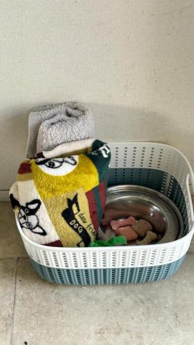 a basket filled with towels and a bowl of food at CASALIE at Seasalter Whitstable in Seasalter