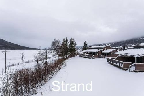 a group of buildings covered in snow at Beach Villa Åre in Åre