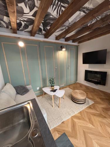 Χώρος καθιστικού στο Love Room balnéo double & sauna Privés - Nuit d'exception