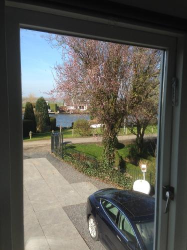 a view of a car parked outside a door at Aan de Vecht in Nederhorst den Berg