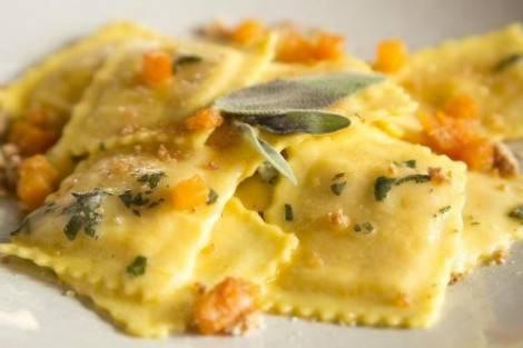 a close up of a plate of food with cheese at Picasso Boutique Hotel in Arad