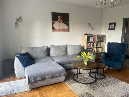 a living room with a couch and a table at Dom na Zdrowiu in Łódź