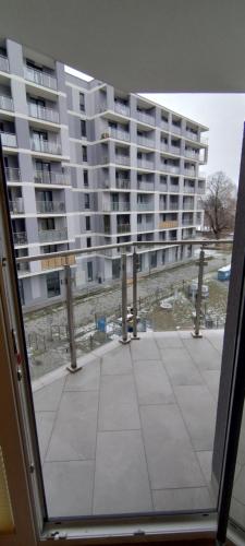 a view of a large apartment building from a window at Apartament Wenus in Lublin