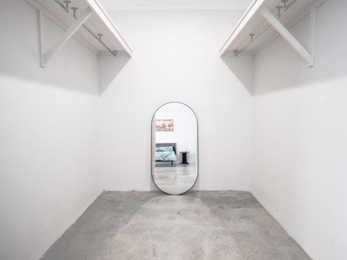 a mirror in a white wall in a room at Guest Room with Ensuite & Private Entrance by P2 Living in Vasse