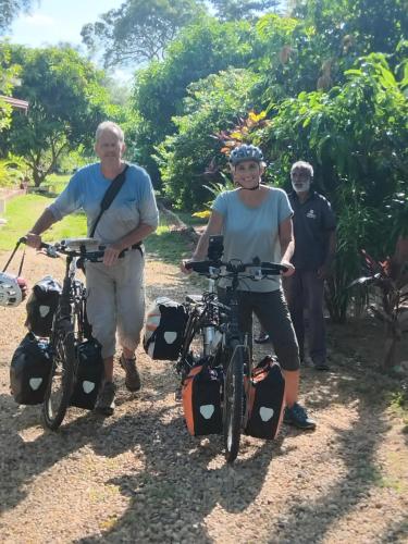 two people standing with their bikes on a trail at Ethili Lake view & Safari Camp in Wellawaya