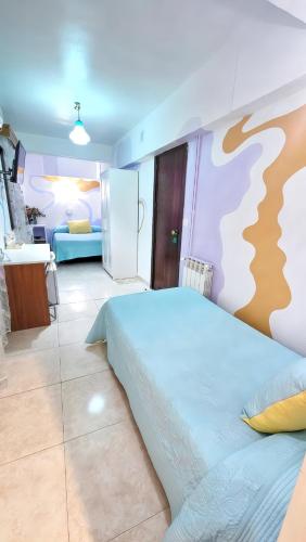 Postel nebo postele na pokoji v ubytování Hostal La Rosa