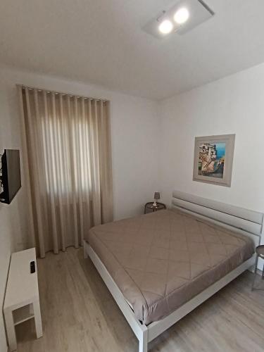 a bedroom with a large bed in a room at LA CASA DEL NOCE in Ruffano