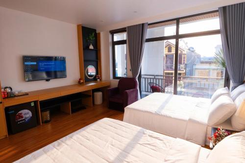 Ένα ή περισσότερα κρεβάτια σε δωμάτιο στο CELINA HOTEL Ninh Bình
