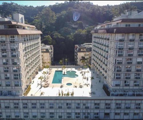 an aerial view of a building with a pool at Studio M21 - Granja Brasil Itaipava in Araras Petropolis