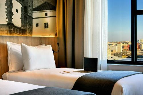 Una cama o camas en una habitación de ADAY Hotel Casablanca
