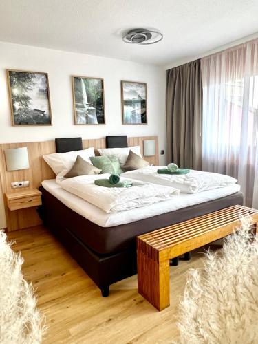 a bedroom with a large bed in a room at Ferienwohnung Wolkenfrei in Inzell mit Pool und Sauna in Inzell