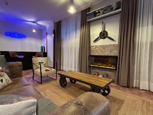 a living room with a couch and a fireplace at Hotel Spa San Marcos in Santillana del Mar
