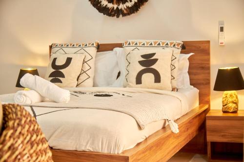 Una cama o camas en una habitación de Résidence Alicia Studio luxueux et confortable