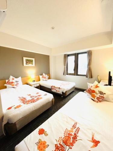 Katil atau katil-katil dalam bilik di Hotel Naha City -Kokusai Street-