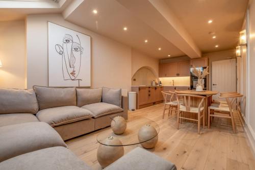 a living room with a couch and a table at Luxury Quayside Loft Sleeps 6 in Newcastle upon Tyne